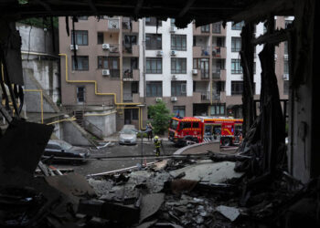 Russian strikes on Kyiv kill one, school burning