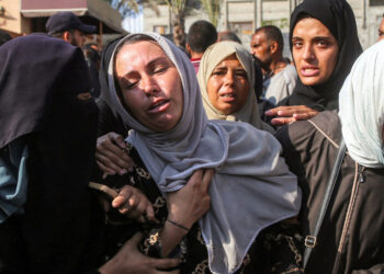 Scuffle on stage at London opera as performer unfurls Palestinian flag