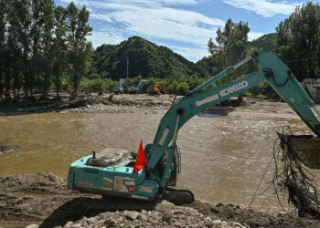 Tens of thousands evacuated as torrential rains drench south China