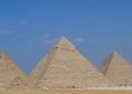 Monumental art displayed in shade of Egypt's pyramids